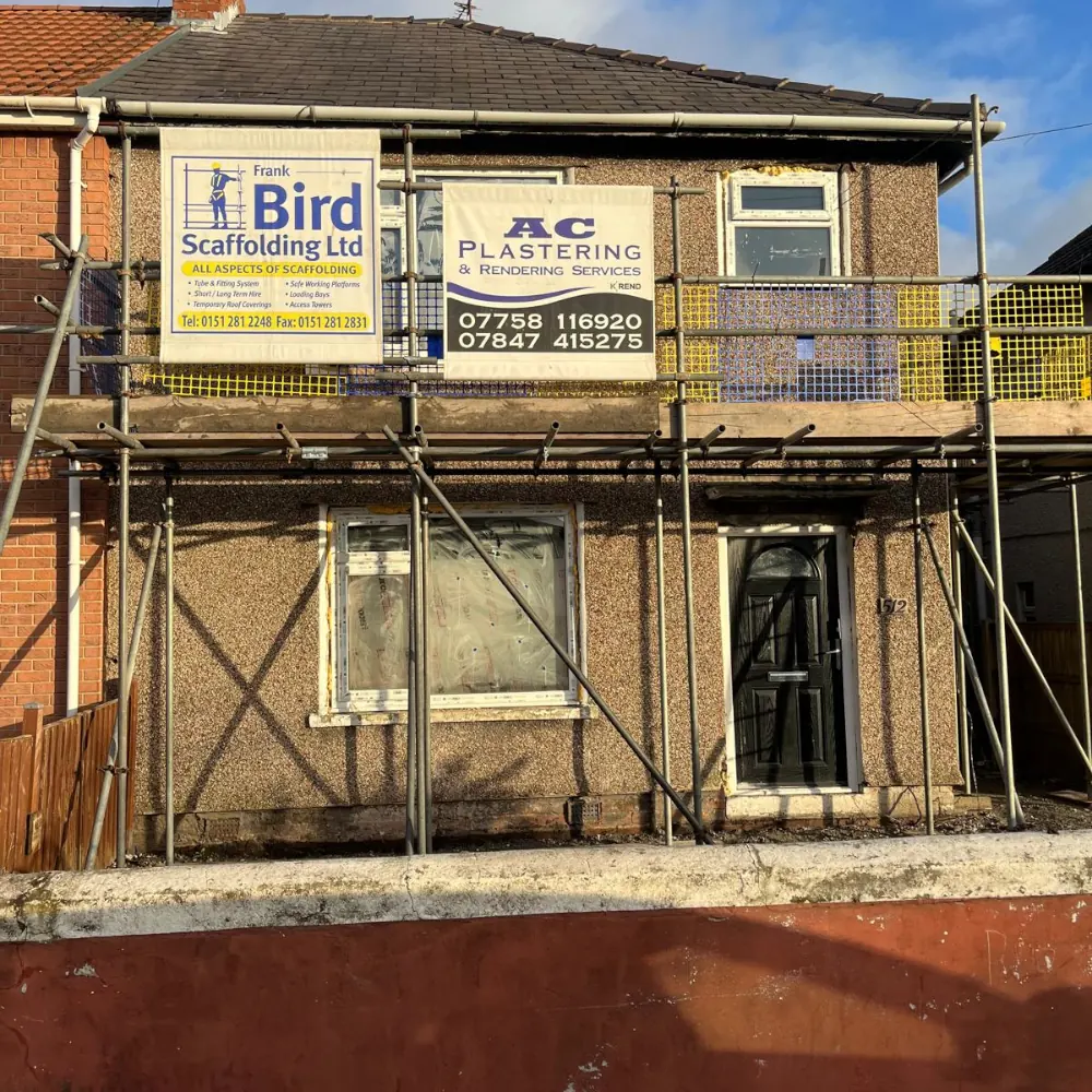 House under renovation with scaffolding