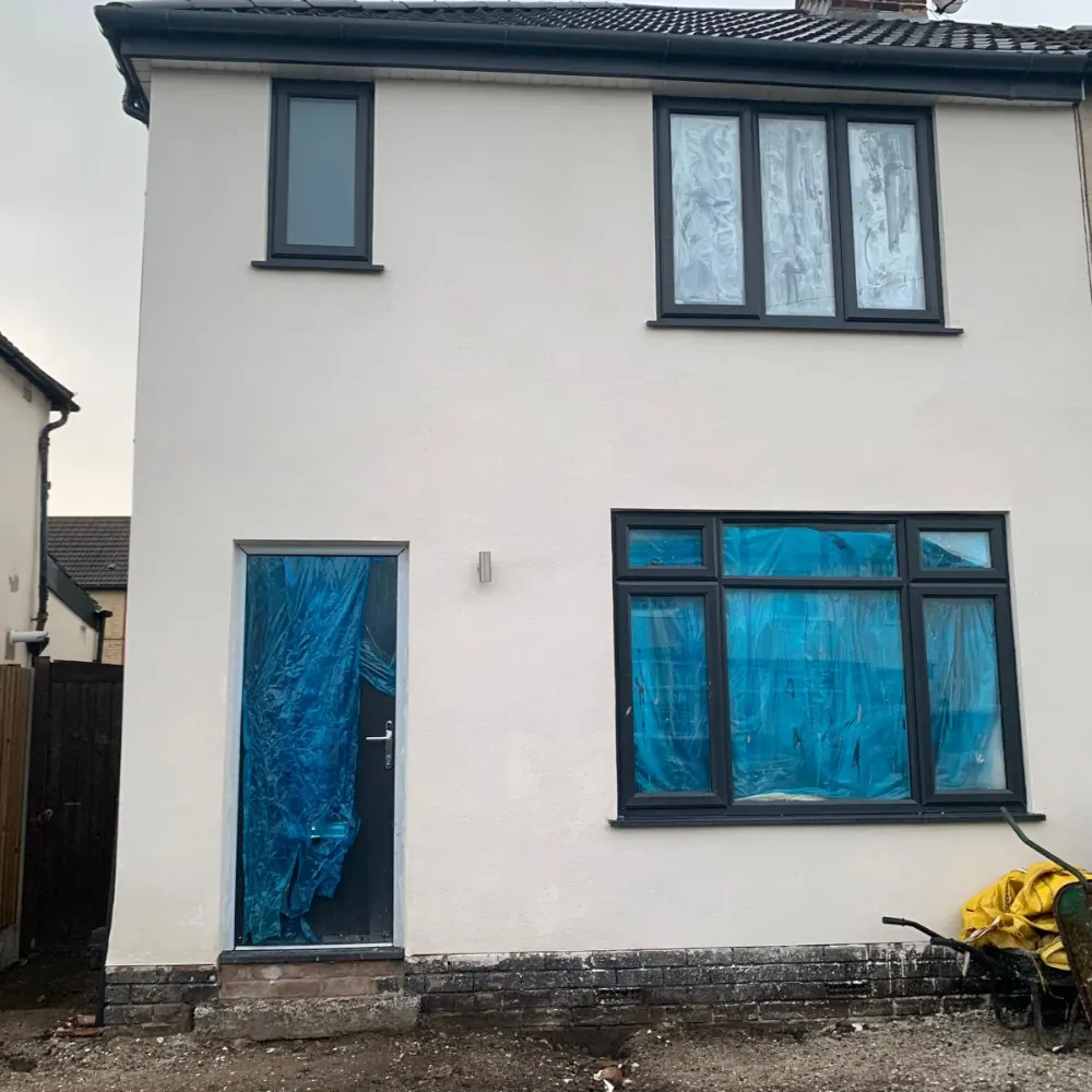 Bright white silicone rendering on a modern double-fronted house exterior