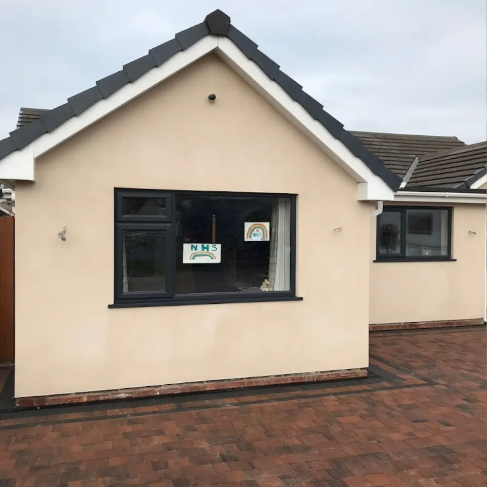 Render cleaning and maintenance service on a residential building front